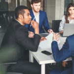 black businessman think.Young team of blurred coworkers making great business .Teamwork people concept