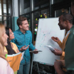 Positive creative delighted colleagues are exchanging ideas Positive creative delighted colleagues are exchanging ideas